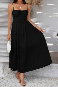 Woman wearing Sleeveless Smocked Tiered Maxi Dress-Breeze through sunny days in this Solid Sleeveless Smocked Tiered Maxi Cami Dress. Offering a flowy, feminine silhouette with effortless comfort. 