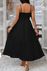 Woman wearing Sleeveless Smocked Tiered Maxi Dress-Breeze through sunny days in this Solid Sleeveless Smocked Tiered Maxi Cami Dress. Offering a flowy, feminine silhouette with effortless comfort. 