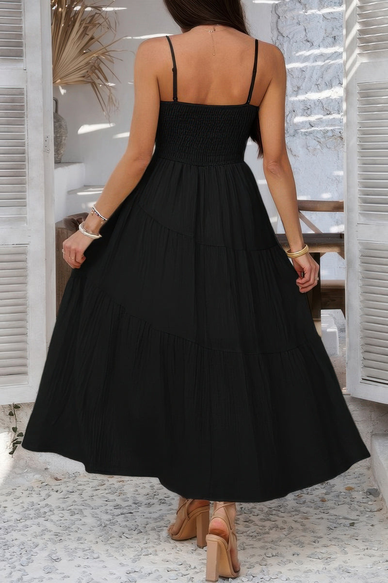 Woman wearing Sleeveless Smocked Tiered Maxi Dress-Breeze through sunny days in this Solid Sleeveless Smocked Tiered Maxi Cami Dress. Offering a flowy, feminine silhouette with effortless comfort. 