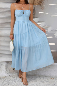 Woman wearing Sleeveless Smocked Tiered Maxi Dress-Breeze through sunny days in this Solid Sleeveless Smocked Tiered Maxi Cami Dress. Offering a flowy, feminine silhouette with effortless comfort. 