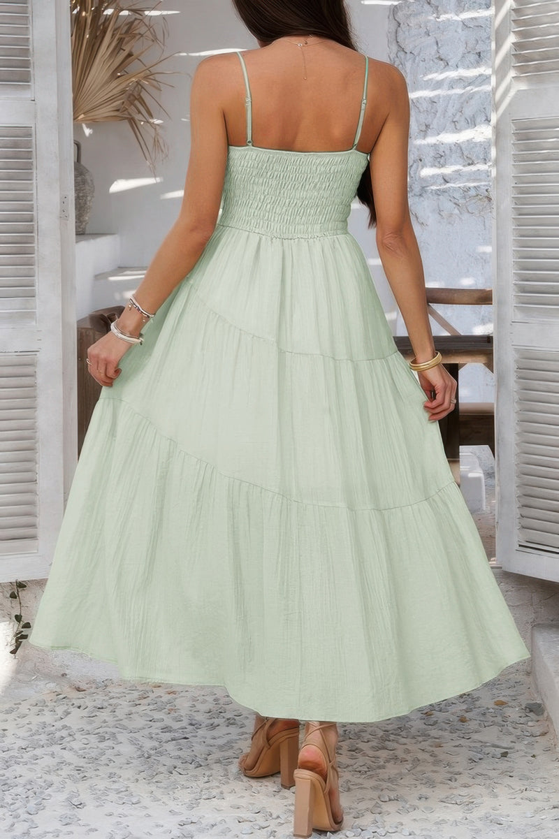 Woman wearing Sleeveless Smocked Tiered Maxi Dress-Breeze through sunny days in this Solid Sleeveless Smocked Tiered Maxi Cami Dress. Offering a flowy, feminine silhouette with effortless comfort. 