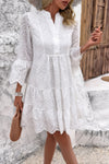 Woman wearing Button Flared Sleeve Hollow Out Lace Dress-Step into timeless elegance with this V-Neck Button Flared Sleeves Hollow Out Lace Dress, perfect for special occasions or everyday sophistication.