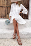 Woman wearing Button Flared Sleeve Hollow Out Lace Dress-Step into timeless elegance with this V-Neck Button Flared Sleeves Hollow Out Lace Dress, perfect for special occasions or everyday sophistication.