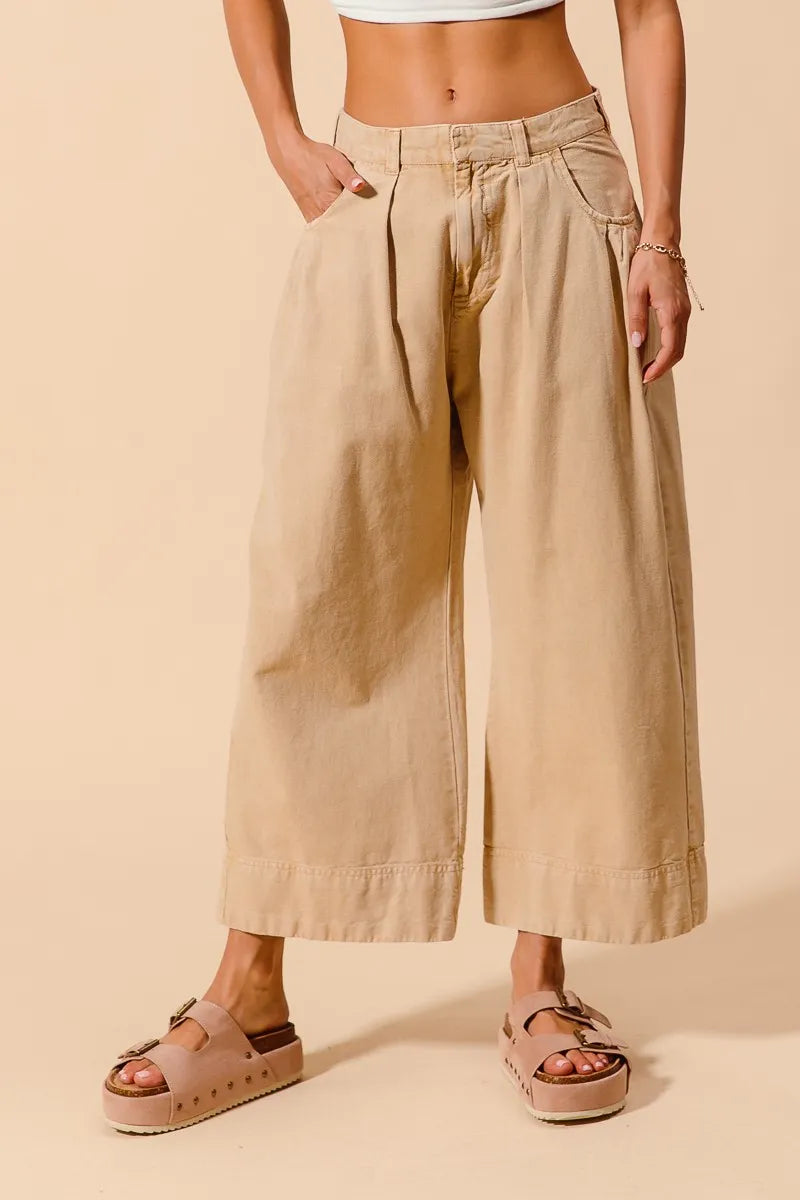 Shop Wide Leg Chino Pants With Pockets-Effortlessly Stylish Wide-Leg Cropped Chino Pants, flattering mid-rise fit and a relaxed wide leg silhouette. Designed with pleated details and side pockets.-available at Reef Love online boho-chic boutique