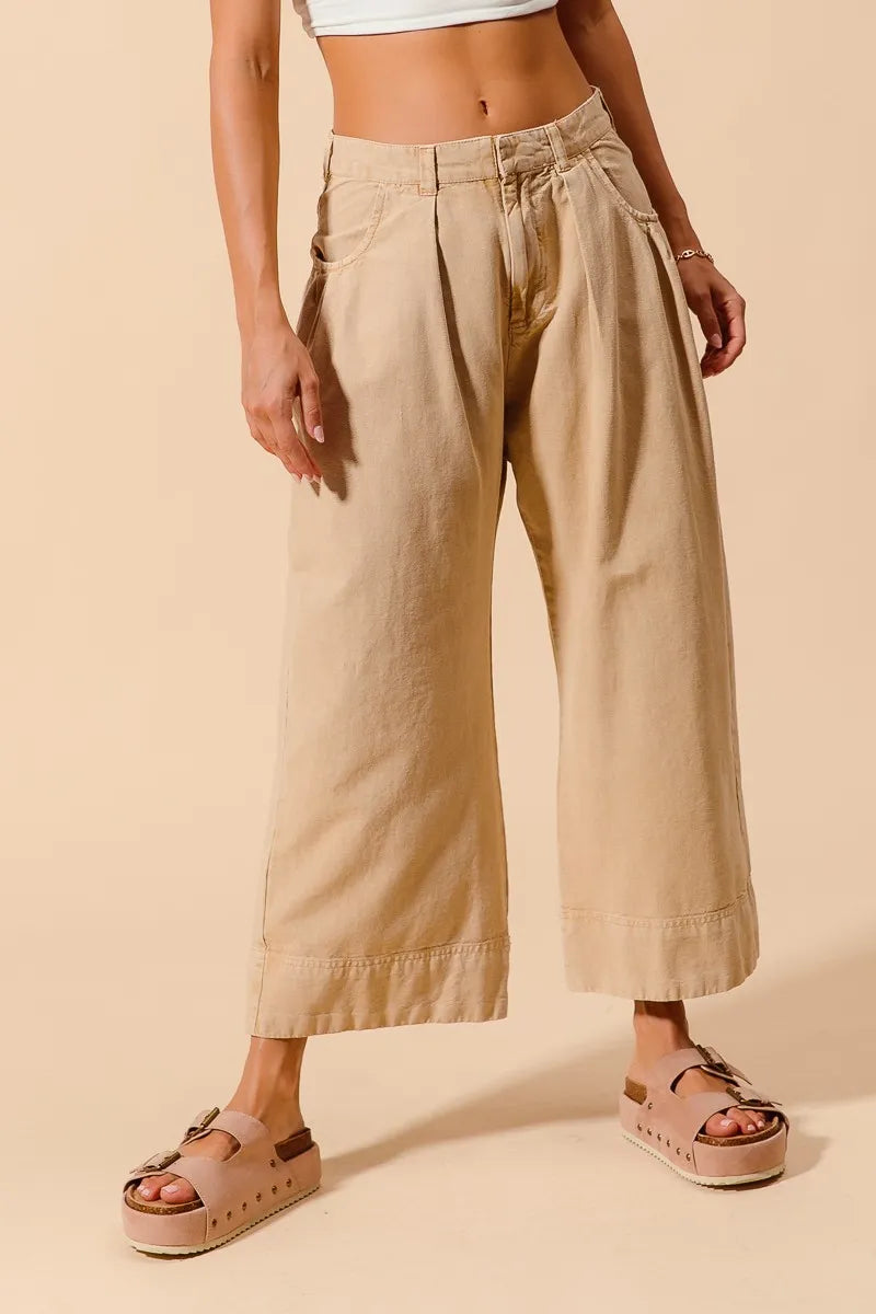 Shop Wide Leg Chino Pants With Pockets-Effortlessly Stylish Wide-Leg Cropped Chino Pants, flattering mid-rise fit and a relaxed wide leg silhouette. Designed with pleated details and side pockets.-available at Reef Love online boho-chic boutique