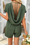 Shop Willow Back Strap Drape Romper-Relaxed green romper with a deep V-neck, scoop back with strap detail, and pockets. Lightweight and breezy—perfect for beach, vacation, or casual days.-available at Reef Love online boho-chic boutique