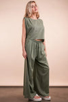 Women's Olive Green woven top and pants set is a versatile and chic outfit option that offers a coordinated and put-together look.