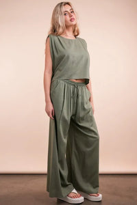 Women's Olive Green woven top and pants set is a versatile and chic outfit option that offers a coordinated and put-together look.