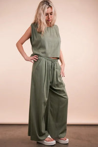 Women's Olive Green woven top and pants set is a versatile and chic outfit option that offers a coordinated and put-together look.