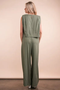 Women's Olive Green woven top and pants set is a versatile and chic outfit option that offers a coordinated and put-together look.