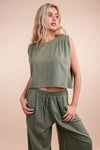 Women's Olive Green woven top and pants set is a versatile and chic outfit option that offers a coordinated and put-together look.