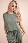 Women's Olive Green woven top and pants set is a versatile and chic outfit option that offers a coordinated and put-together look.