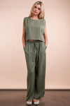 Women's Olive Green woven top and pants set is a versatile and chic outfit option that offers a coordinated and put-together look.