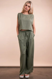 Women's Olive Green woven top and pants set is a versatile and chic outfit option that offers a coordinated and put-together look.
