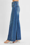 Woman wearing High Rise Wide Ankle Seam Detailed Jeans-Flattering high-rise ankle jeans with bold wide seams & raw hems. Available in standard & plus sizes. Slight stretch for comfort and everyday style.