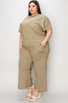 Textured, stretchy, and comfy. This two piece cropped pant with short sleeve top is a great travel set to stay comfortable in the car or plane. Available in a variety of colors and extended sizes.