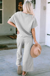 Textured, stretchy, and comfy. This two piece cropped pant with short sleeve top is a great travel set to stay comfortable in the car or plane. Available in a variety of colors and extended sizes.