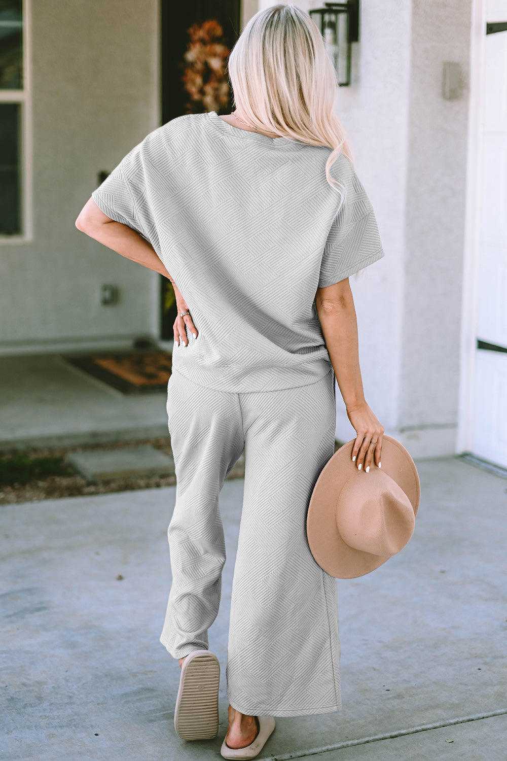 Textured, stretchy, and comfy. This two piece cropped pant with short sleeve top is a great travel set to stay comfortable in the car or plane. Available in a variety of colors and extended sizes.