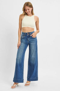 Woman wearing High Rise Wide Ankle Seam Detailed Jeans-Flattering high-rise ankle jeans with bold wide seams & raw hems. Available in standard & plus sizes. Slight stretch for comfort and everyday style.