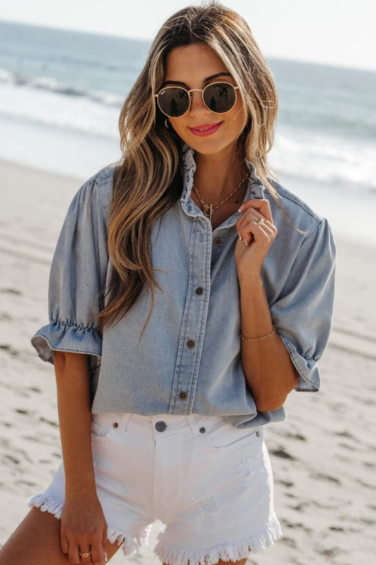 Charming light wash chambray ruffle puff sleeve shirt, perfect for summer.