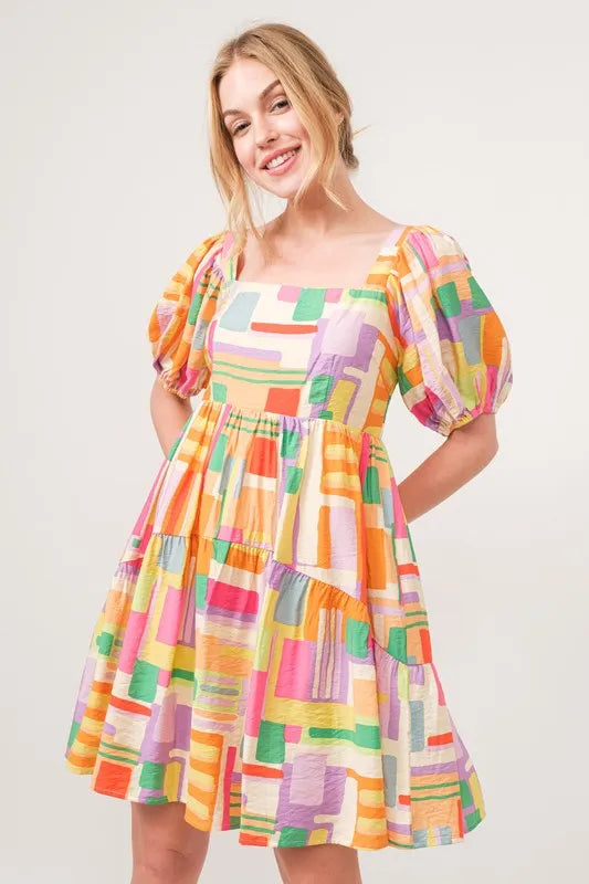 Square Neck Puff Sleeve Geo Printed Mini Dress-The square neck puff sleeve geo printed mini dress is a fashionable and eye-catching choice for a stylish ensemble. The square neckline adds a modern and chic touch-Reef Love Boho-Chic Boutique