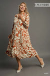Woman wearing Floral Tiered Midi Shirt Dress-Flowy floral tiered midi shirt dress with 3/4 sleeves in rust + beige print. Boho-chic style in standard & plus sizes for casual or dressy days.