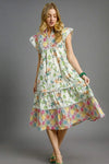 Woman wearing Patchwork Garden Midi Dress-Boho-inspired midi dress features a delightful floral print on flowing fabric that moves beautifully. perfect for warm weather, casual daywear to vacation styling. 