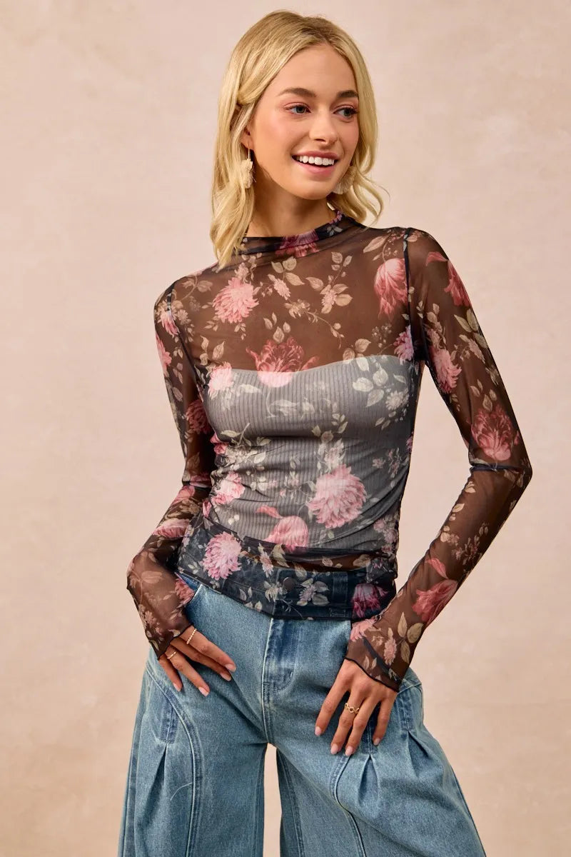 Shop Flower Printed Sheer Mesh Top with Thumb Opening-This stunning sheer mesh blouse features a romantic floral print in soft pink and coral tones against a dark base. Stretchy semi-transparent mesh fabric.-Reef Love Boho-Chic Boutique