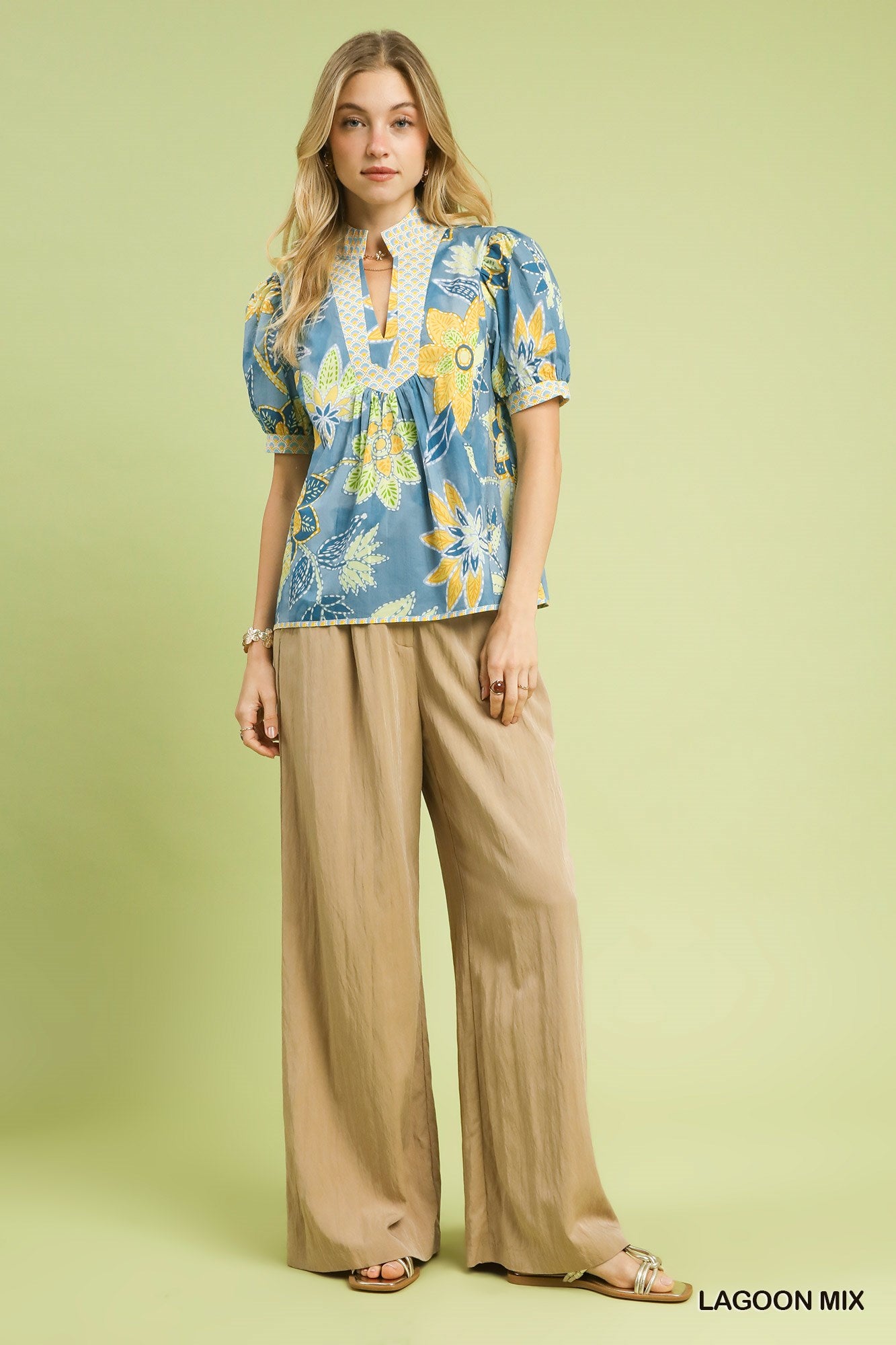 Vibrant Lagoon Mix floral print puff sleeve blouse with high neckline, perfect for warm weather.