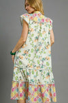 Woman wearing Patchwork Garden Midi Dress-Boho-inspired midi dress features a delightful floral print on flowing fabric that moves beautifully. perfect for warm weather, casual daywear to vacation styling. 