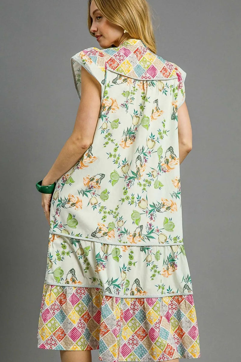 Woman wearing Patchwork Garden Midi Dress-Boho-inspired midi dress features a delightful floral print on flowing fabric that moves beautifully. perfect for warm weather, casual daywear to vacation styling. 