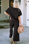 Textured, stretchy, and comfy. This two piece cropped pant with short sleeve top is a great travel set to stay comfortable in the car or plane. Available in a variety of colors and extended sizes.