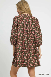 Woman wearing Fall Floral Tie-Neck Babydoll Dress-Fall floral tie-neck babydoll dress is a charming choice for any occasion. The tie-neck detail adds a touch of elegance to the sweet babydoll silhouette.