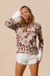 Shop Flower Printed Waffle Thumb Opening Top-Cozy and casual, flower printed waffle knit top features thumb openings, a classic crew neck, and a relaxed fit. Ideal for layering during transitional seasons.-Reef Love Boho-Chic Boutique