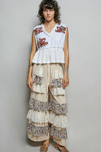 POL Floral Patch Ruffled Sleeveless Top in white with raw edge detail and peplum hem.