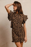 Woman wearing Leopard Print Waffle Texture Layered Ruffle Sleeve Top and Shorts Set-This leopard print set features a leopard print waffle texture top with layered ruffle sleeves, paired with matching shorts for a coordinated and stylish look. 