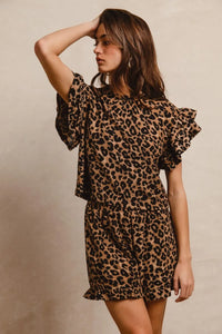 Woman wearing Leopard Print Waffle Texture Layered Ruffle Sleeve Top and Shorts Set-This leopard print set features a leopard print waffle texture top with layered ruffle sleeves, paired with matching shorts for a coordinated and stylish look. 