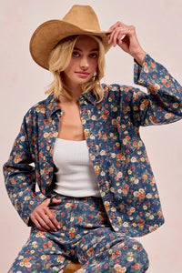 Shop Washed Floral Print Denim Shacket-This Washed Floral Print Denim Shacket features a relaxed oversized fit, button front, and vintage floral wash. Pair with wide leg jeans to complete the look.-Reef Love Boho-Chic Boutique