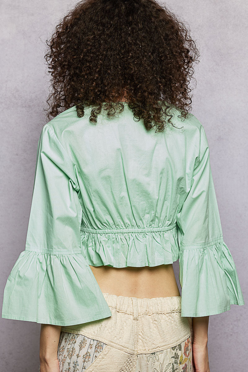 Mint boho floral embroidered cropped blouse with flared ruffle sleeves and elastic waistband.