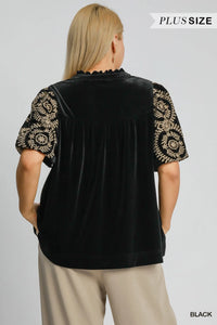 Woman wearing Velvet Embroidered Sleeve Blouse-This velvet embroidered sleeve blouse combines luxe velvet with embroidery for a sophisticated and stylish look. Perfect for adding a touch of glamour to your outfit.