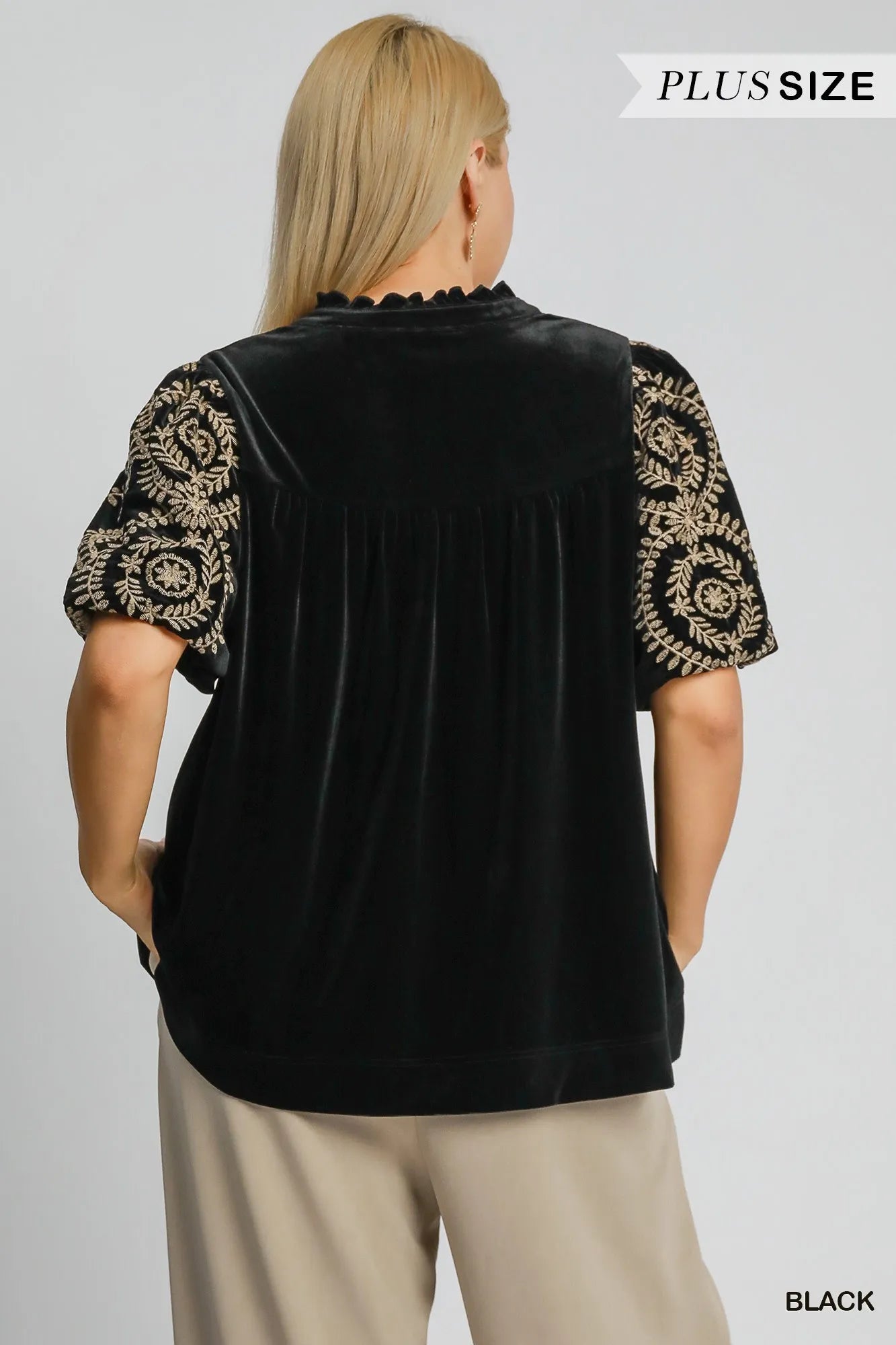 Woman wearing Velvet Embroidered Sleeve Blouse-This velvet embroidered sleeve blouse combines luxe velvet with embroidery for a sophisticated and stylish look. Perfect for adding a touch of glamour to your outfit.