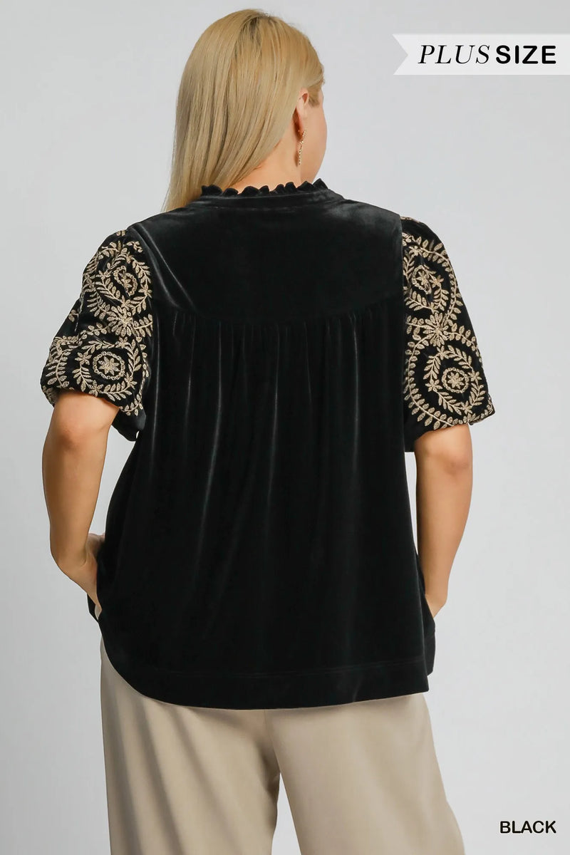Woman wearing Velvet Embroidered Sleeve Blouse-This velvet embroidered sleeve blouse combines luxe velvet with embroidery for a sophisticated and stylish look. Perfect for adding a touch of glamour to your outfit.