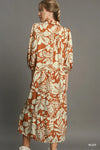 Woman wearing Floral Tiered Midi Shirt Dress-Flowy floral tiered midi shirt dress with 3/4 sleeves in rust + beige print. Boho-chic style in standard & plus sizes for casual or dressy days.