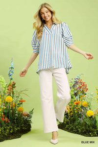 Chic blue mix striped puff sleeve blouse with a V-neck and wide collar, paired with white pants.
