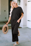 Textured, stretchy, and comfy. This two piece cropped pant with short sleeve top is a great travel set to stay comfortable in the car or plane. Available in a variety of colors and extended sizes.
