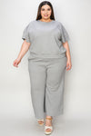 Textured, stretchy, and comfy. This two piece cropped pant with short sleeve top is a great travel set to stay comfortable in the car or plane. Available in a variety of colors and extended sizes.