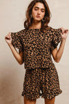 Woman wearing Leopard Print Waffle Texture Layered Ruffle Sleeve Top and Shorts Set-This leopard print set features a leopard print waffle texture top with layered ruffle sleeves, paired with matching shorts for a coordinated and stylish look. 