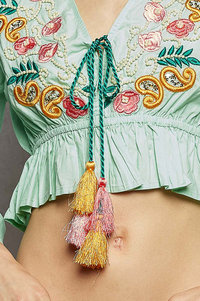 Mint Boho Floral Embroidered Cropped Blouse with braided neck tie, tassels, and delicate bead details.